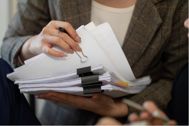 Image of a compliance officer managing multiple cases